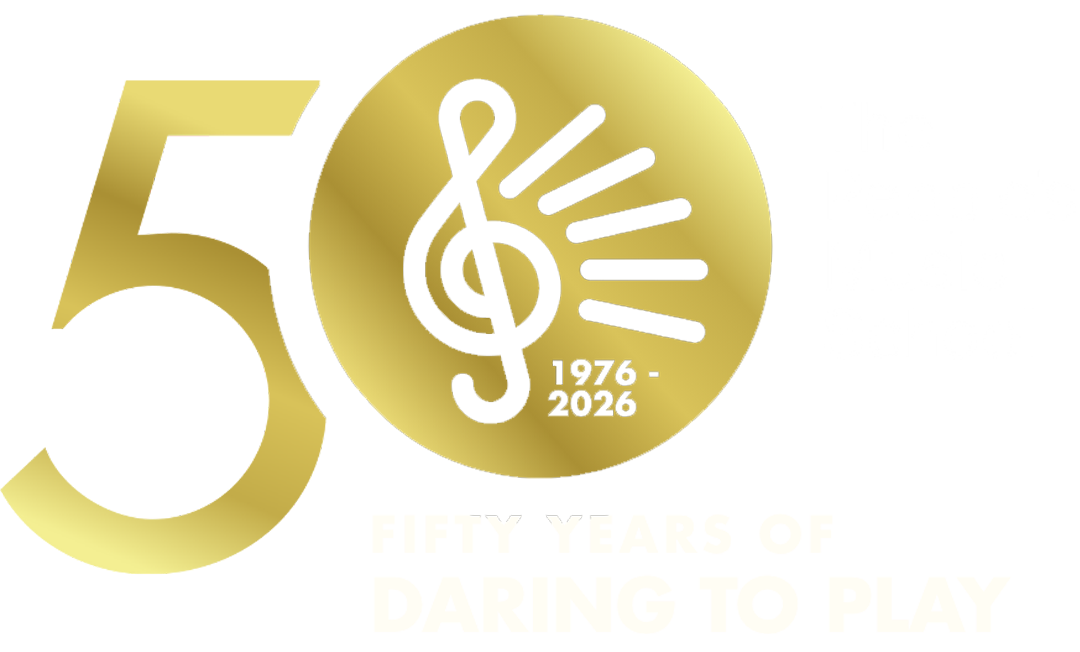 Gold and white 50 Years of Daring to Play Logo with a large 50 and the TPMS treble clef